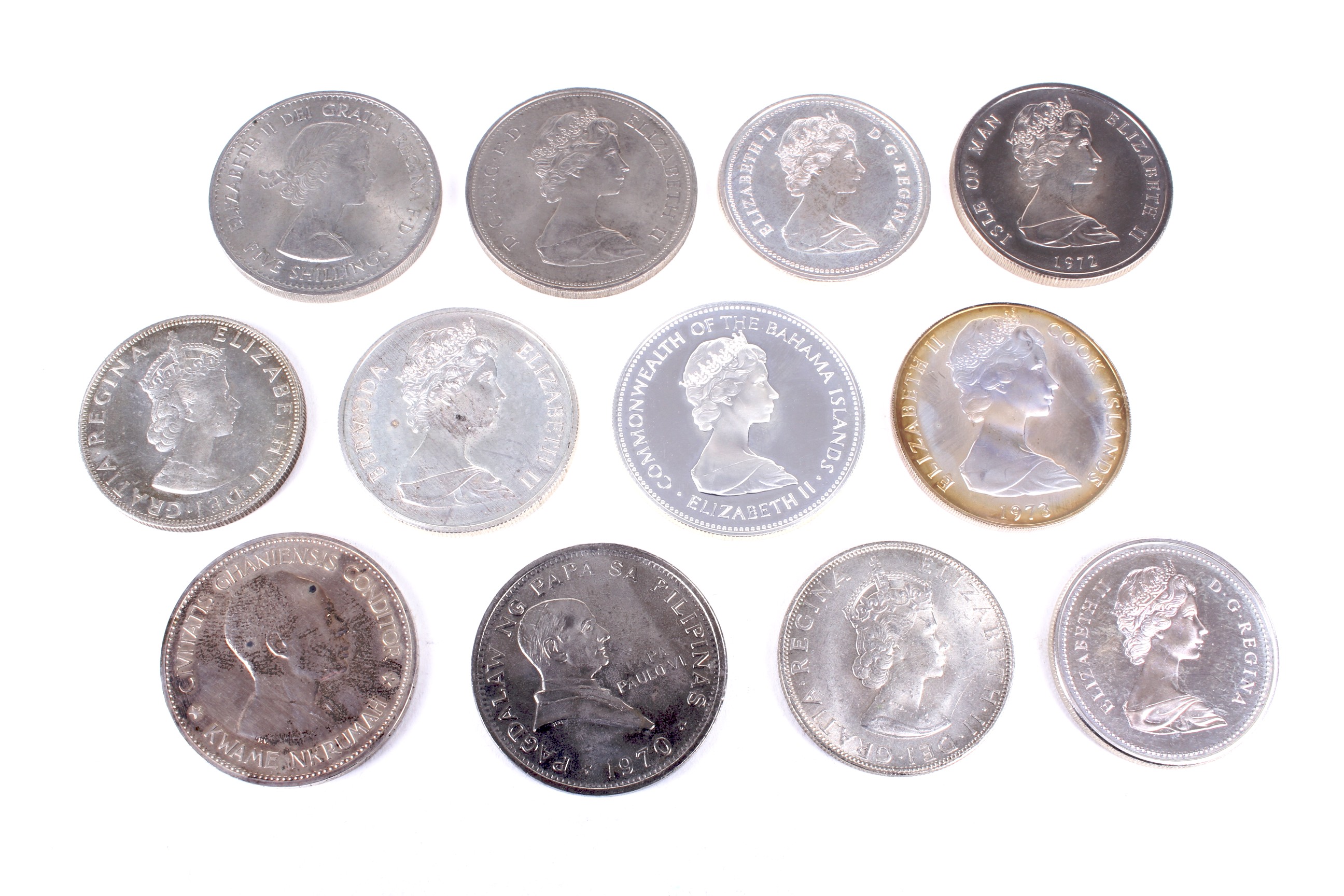 Twelve crown-size world coins, some silver.