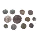 Twelve Roman coins, including one of silver.
