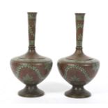 A pair of late 19th/early 20th century bronzed Indian metal vases.