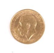 A 1911 gold sovereign coin.