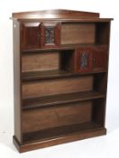 An Edwardian mahogany free standing open bookcase.