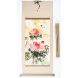 A Chinese scroll painting. Painted with pink peonies and foliage in watercolour on paper.