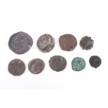Nine ancient coins, seven being Roman.