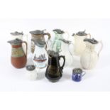 A group of 19th century Staffordshire pottery and stoneware relief-moulded pewter-mounted jugs.