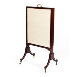 A 19th century mahogany fire screen.