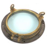 A maritime brass port hole.