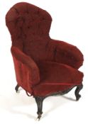 A Victorian mahogany framed button back rise and fall elbow chair.