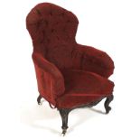 A Victorian mahogany framed button back rise and fall elbow chair.