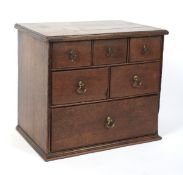 An early 19th century oak apothecary's chest.
