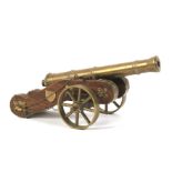 An artillery brass mounted desk top cannon.
