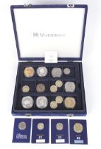 A box of modern coins including three silver proof £5 coins, etc.