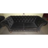 A large Clive Christian Chesterfield sofa.