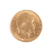 A 1909 gold sovereign coin.