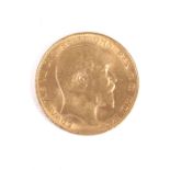 A 1909 gold sovereign coin.