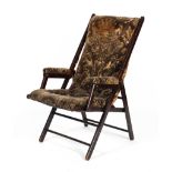 A Victorian folding upholstered steamer-type chair.