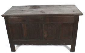 An 18th century stained oak paneled coffer. With wire hinges and replacement lock.