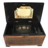 An Early 20th century rosewood and satin wood inlay Swiss music box.