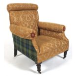 A Victorian upholstered armchair.