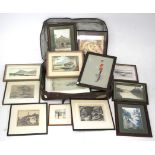 A suitcase of vintage watercolours, pictures and prints.