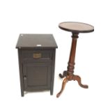 A dark stained bedside cabinet and a round mahogany occasional table.