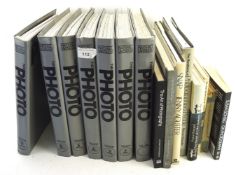 An assortment of photography books and magazines including The Photo Volumes 1-7