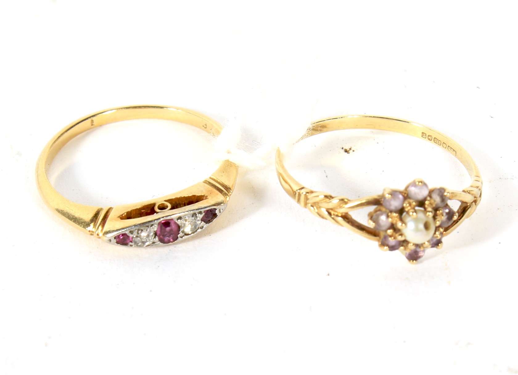 A 9ct gold ladies ring and a yellow metal diamond and red stone set ring.