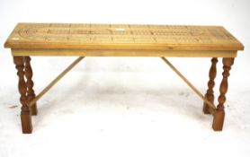 A contemporary floor standing cribbage board. L101cm x D28.