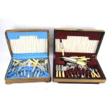 Two mid century wooden cased canteens of cutlery.