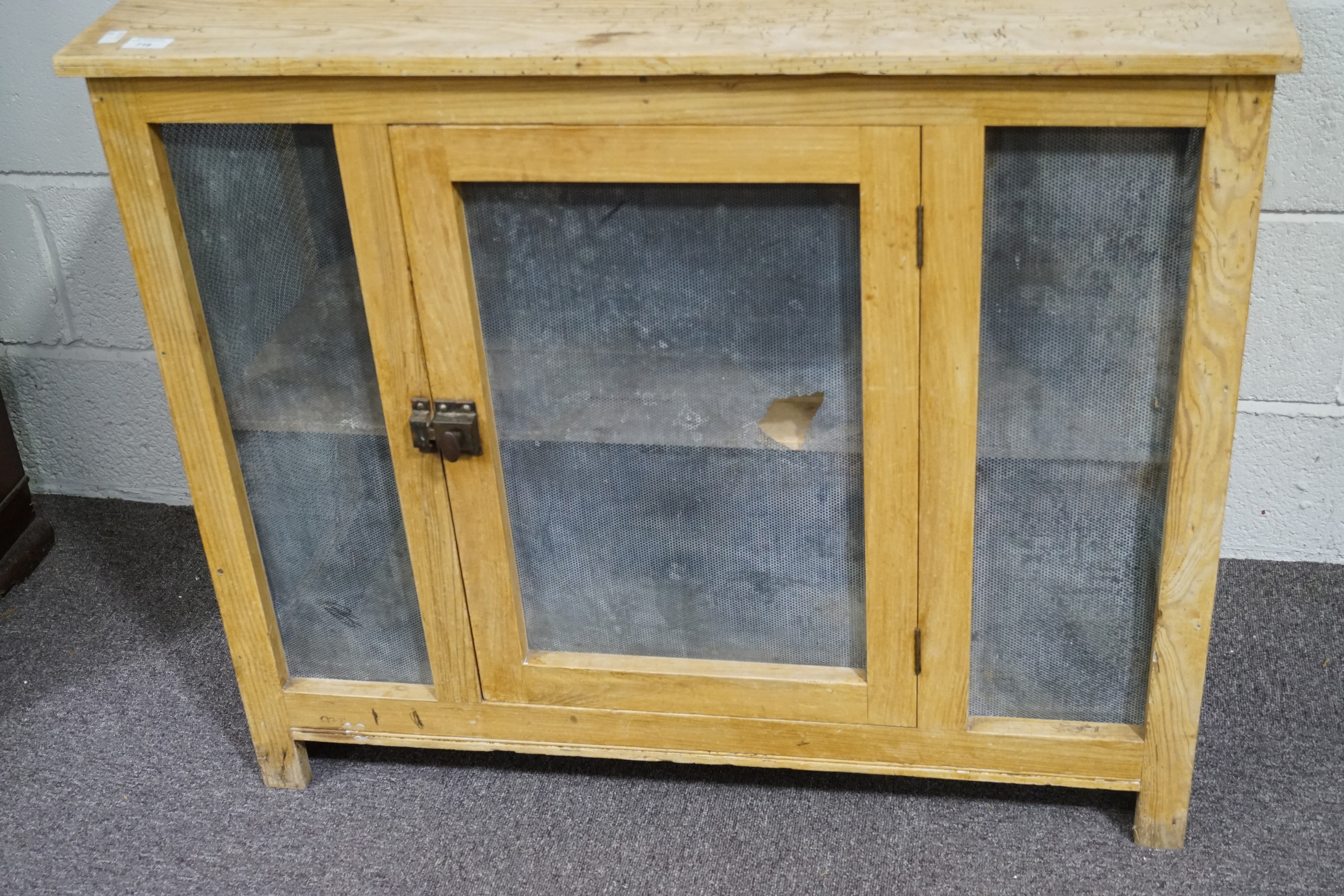 A Continental pine cheese cupboard.