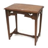 An oak Arts & Crafts side table with pierced decoration.