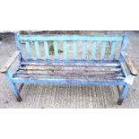 A wooden garden bench. With remnants of pale blue paint.