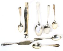 An assortment of silver spoons and similar flatware.