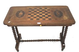 A Victorian mahogany games side table the top set with an inlaid chess board.