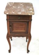 An Edwardian mahogany marble topped bedside cabinet.