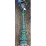 A 20th century green painted cast metal outside lamp post.