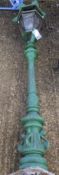 A 20th century green painted cast metal outside lamp post.