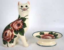 A Wemyss G Hill pottery figure of a cat together with a dish.