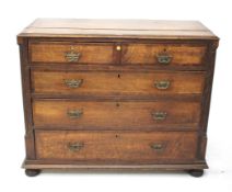 A 19th century oak chest of drawers with mahogany cross banding.
