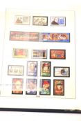 A collection of contemporary Franklin Mint stamps.