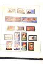 A collection of contemporary Franklin Mint stamps.