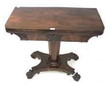 A 19th century rosewood fold-over games table.