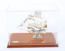 A small silver model of the ship 'Mayflower'.
