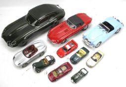 A collection of die cast model cars.