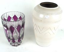 A large glazed ceramic vase and a Bohemian large ruby glass vase.