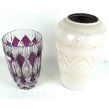 A large glazed ceramic vase and a Bohemian large ruby glass vase.