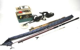 An assortment of fishing rods and tackle and a metal detector.
