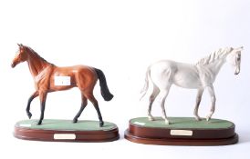 Two Royal Doulton figures of horses.