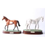 Two Royal Doulton figures of horses.