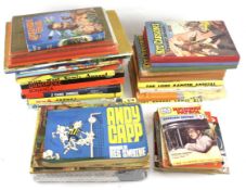 Two boxes of assorted annuals and comics.