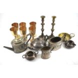 An assortment of metalware and silver plate. Including teapots, goblets, candlesticks, etc.